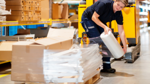 A person wrapping a pallet with pallet wrap