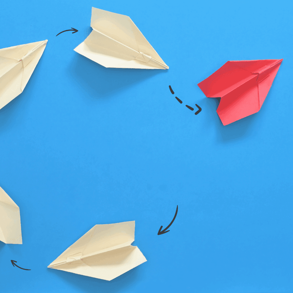 Paper planes flying in different directions